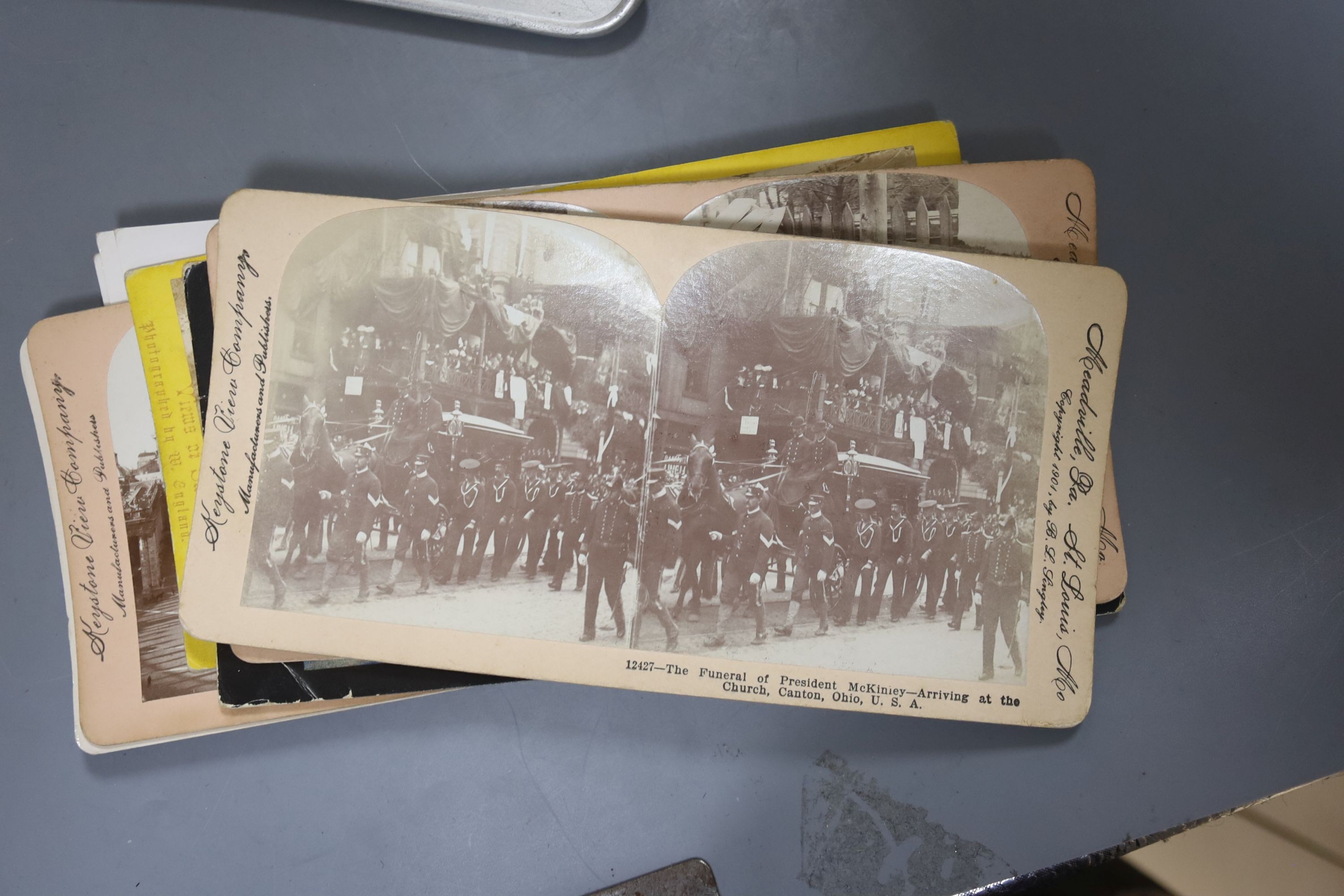 A boxed stereoscopic viewer and collection of cards, viewer 32 cms long.